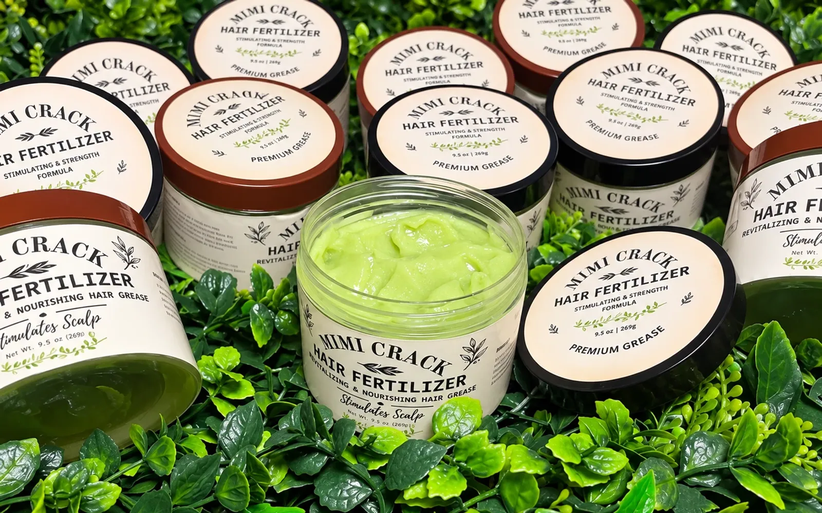 MiMi Crack jars on a bed of greenery, one open